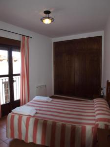 Postel nebo postele na pokoji v ubytování Apartamentos El Mirador