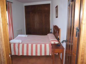 Postel nebo postele na pokoji v ubytování Apartamentos El Mirador