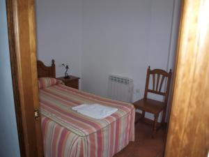 Postel nebo postele na pokoji v ubytování Apartamentos El Mirador