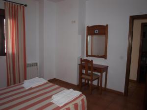Postel nebo postele na pokoji v ubytování Apartamentos El Mirador