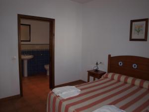 Postel nebo postele na pokoji v ubytování Apartamentos El Mirador