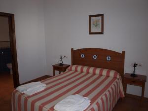 Postel nebo postele na pokoji v ubytování Apartamentos El Mirador
