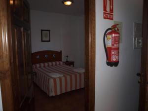 Postel nebo postele na pokoji v ubytování Apartamentos El Mirador