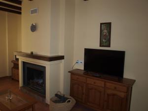 TV a/nebo společenská místnost v ubytování Apartamentos El Mirador