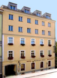 
a large building with a large window at Hotel Goldener Adler in Linz
