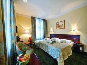 Posteľ alebo postele v izbe v ubytovaní EA Hotel Downtown