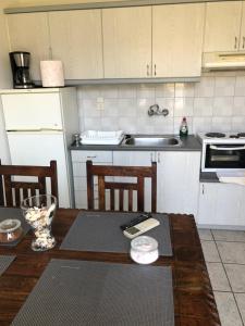 Kuchyň nebo kuchyňský kout v ubytování Mythos Suites-Poseidon apartment