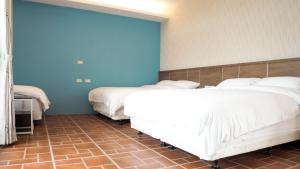 Postel nebo postele na pokoji v ubytování 金門微醺民宿 Kinmen TipsyHotel B&B