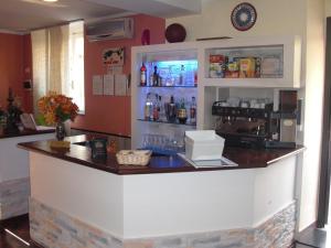 a bar in a restaurant with a counter at Hotel Legnano in Legnano