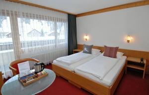 Voodi või voodid majutusasutuse Hotel Crystal toas