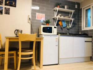 A kitchen or kitchenette at Daol Guesthouse