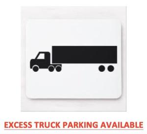 um sinal de estacionamento para camiões com um reboque para camiões em Economy Inn Barstow em Barstow