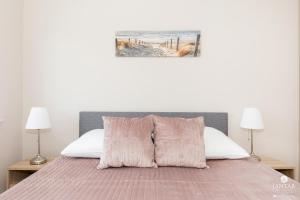 Posteľ alebo postele v izbe v ubytovaní Jantar Apartamenty Bliżej Morza