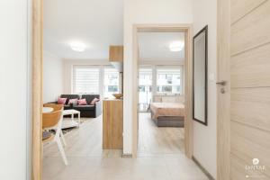 Posteľ alebo postele v izbe v ubytovaní Jantar Apartamenty Bliżej Morza