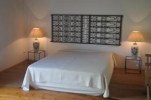 Uma cama ou camas num quarto em Convento de São Francisco