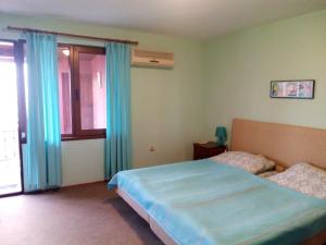 Ліжко або ліжка в номері Regina's Guesthouse