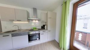 Kuchyň nebo kuchyňský kout v ubytování Gästehaus Neuhauser