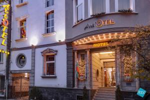 a store front of a hotel with lights on it at Art 'Otel in Sofia