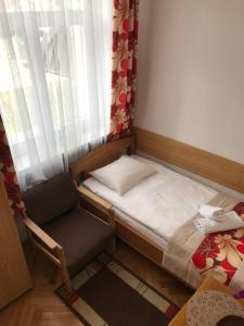 Łóżko lub łóżka w pokoju w obiekcie Pensjonat Adria