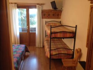 Postel nebo postele na pokoji v ubytování Hotel Lares