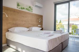 Cama ou camas em um quarto em Julipapas Gardens