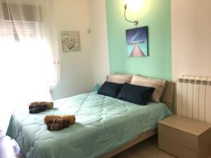 A bed or beds in a room at Suite Paolo