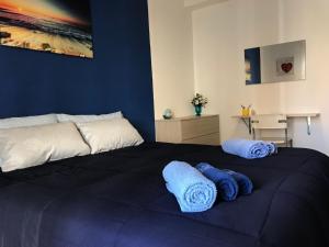 A bed or beds in a room at Suite Paolo