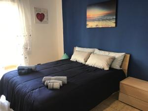 A bed or beds in a room at Suite Paolo