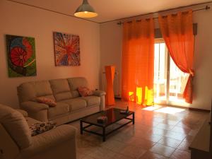 A seating area at Suite Paolo