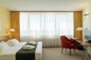 Postel nebo postele na pokoji v ubytování Globana Airport Hotel