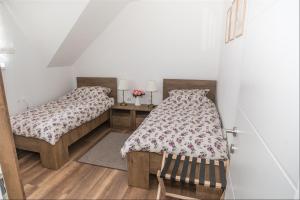 Postel nebo postele na pokoji v ubytování Apartman Hubertus 5*