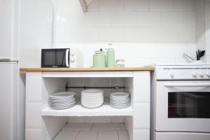 Kuchyňa alebo kuchynka v ubytovaní b21-Apartamento Modernista para Grupos + 7 fotografií