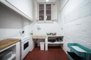 Virtuvė arba virtuvėlė apgyvendinimo įstaigoje b21-Apartamento Modernista para Grupos