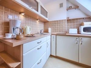 Kuchyňa alebo kuchynka v ubytovaní VisitZakopane - Himalaya Apartment