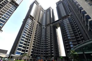 a group of tall buildings in a city at YS Atlantis Residences Melaka - Pool View in Melaka