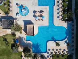 an overhead view of a swimming pool at a resort at AQI Skanes Resort in Monastir