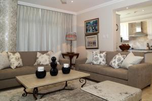 A seating area at 603 Oyster Schelles - by Stay in Umhlanga