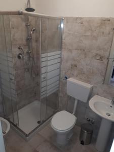 a bathroom with a shower and a toilet and a sink at B&B RELAX in Messina +21 photos