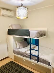 Krevet ili kreveti na sprat u jedinici u okviru objekta Delightful Ocean View Apartment - PH Quartier Del Mar