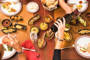 a group of people sitting at a table with food at AQI Skanes Resort in Monastir