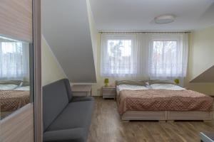 Postel nebo postele na pokoji v ubytování Apartamenty Ewa II