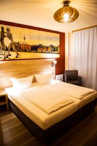 Postel nebo postele na pokoji v ubytování BlnCty Hotel