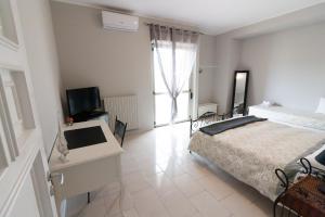 Postel nebo postele na pokoji v ubytování Sottovento B&B
