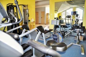 a gym with several treadmills and cardio machines at Straelener Hof in Straelen