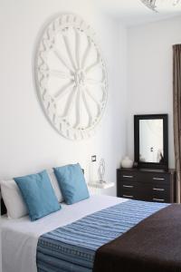 Кровать или кровати в номере Taonasi Mazzarò Apartments