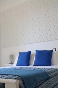 Кровать или кровати в номере Taonasi Mazzarò Apartments
