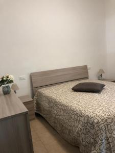 Postel nebo postele na pokoji v ubytování Albergo La Lampara