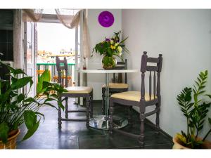 a table and chairs in a room with a window at Apartment Liatris in Split