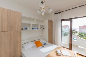 Postel nebo postele na pokoji v ubytování Apartments Villa Daniela + 176 fotografií