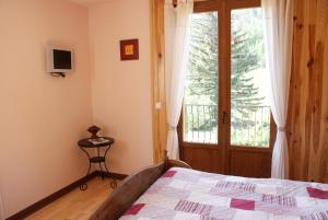 Lova arba lovos apgyvendinimo įstaigoje Maison d' hôtes Tranquyl